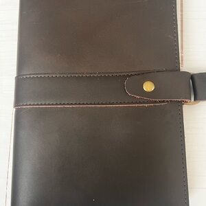 Elegant Brown Leather journal. New; brown leather. Inside space to tuck notes